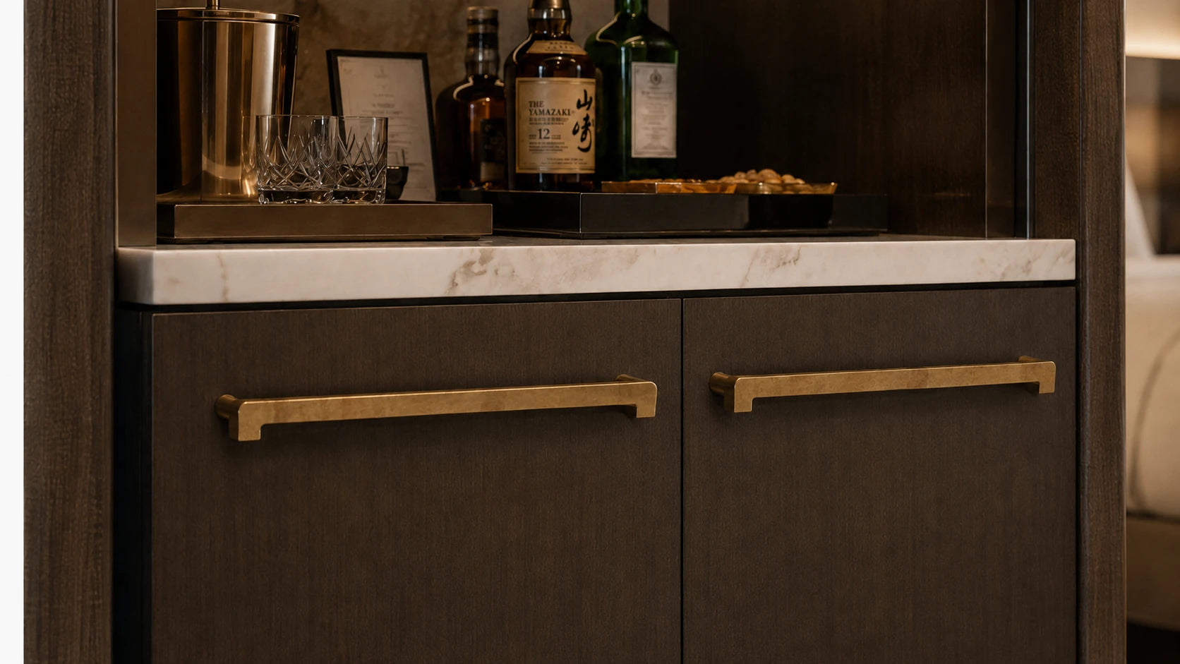 Illustrative hotel minibar cabinetry with Capramont Beaufort cabinet handles